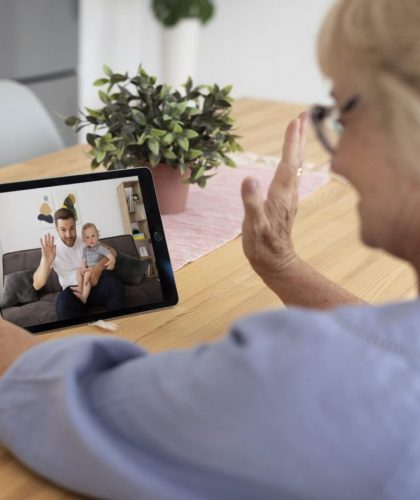 senior-woman-having-videocall-with-her-family